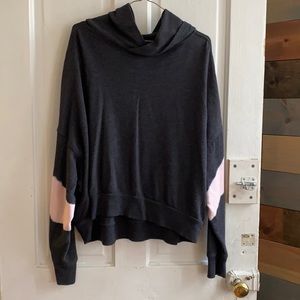Black hoodie with partial pink sleeves.  Size XL